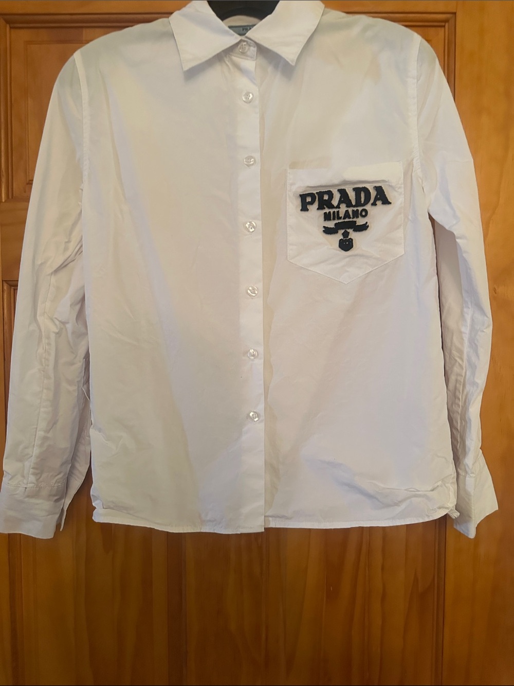 White Button-Up Shirt with Embroidered Chest Logo